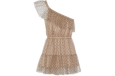 Polka dot sleeveless tulle dress in beige and black .